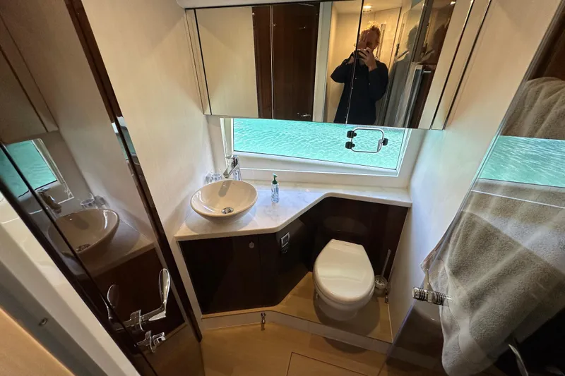  Yacht Photos Pics Bathroom interior of 2020 Fairline Targa 45 Open yacht with modern fixtures and window view.