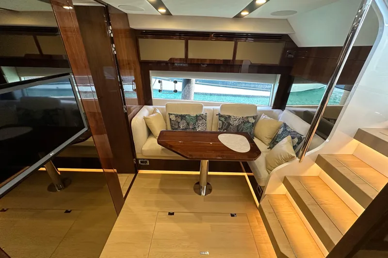  Yacht Photos Pics Luxurious interior of 2020 Fairline Targa 45 Open yacht with elegant seating and wooden table.