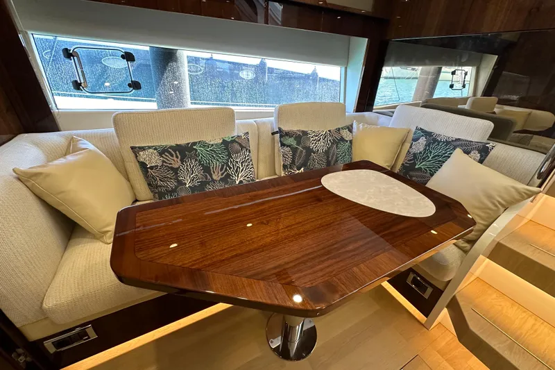  Yacht Photos Pics Luxurious interior of 2020 Fairline Targa 45 Open yacht with elegant seating and wooden table.