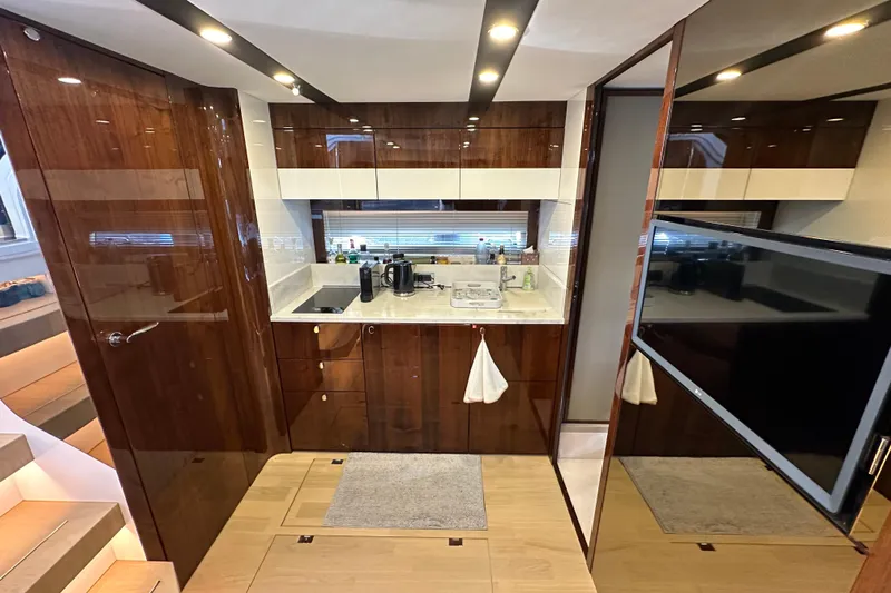  Yacht Photos Pics Luxurious kitchen interior of 2020 Fairline Targa 45 Open yacht with modern amenities.