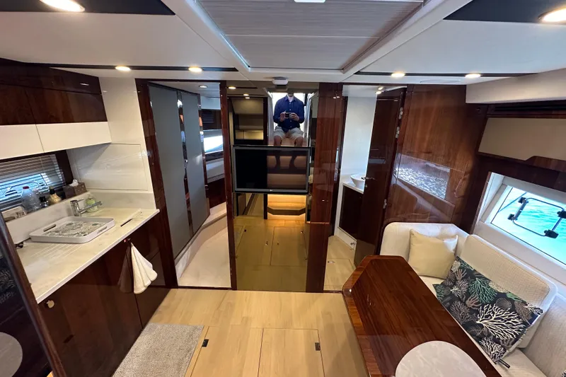  Yacht Photos Pics Interior of 2020 Fairline Targa 45 Open yacht, featuring luxurious wood finishes and modern amenities.