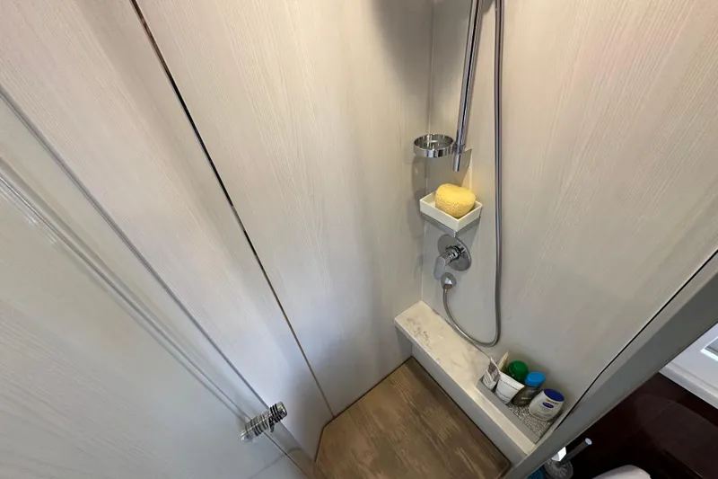  Yacht Photos Pics Shower area in 2020 Fairline Targa 45 Open yacht, featuring modern fixtures and storage.