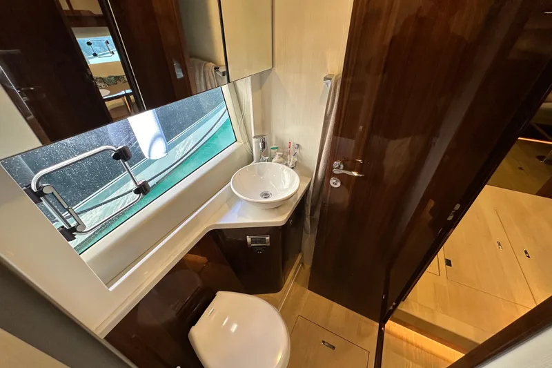  Yacht Photos Pics Luxury bathroom in 2020 Fairline Targa 45 Open yacht, featuring modern fixtures and elegant design.