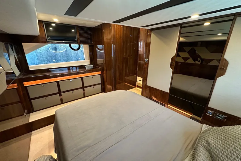  Yacht Photos Pics Luxurious interior of 2020 Fairline Targa 45 Open yacht with wood finishes and modern amenities.