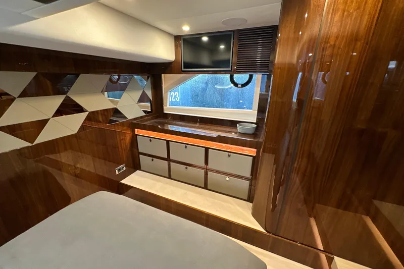  Yacht Photos Pics Luxurious interior of 2020 Fairline Targa 45 Open yacht with wood paneling and modern design.