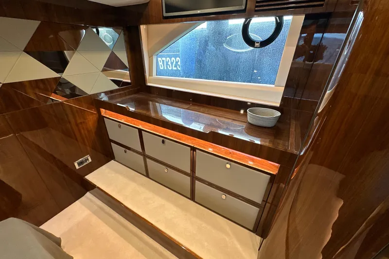  Yacht Photos Pics Luxurious interior of 2020 Fairline Targa 45 Open yacht with wood finish and storage.