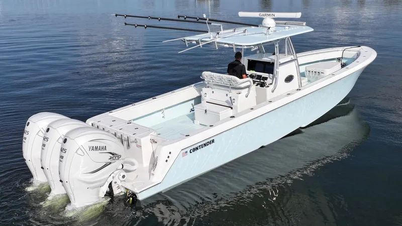  Yacht Photos Pics 2021 Contender 39 ST boat with triple Yamaha engines on calm water.