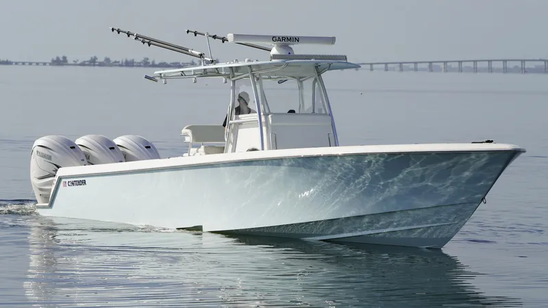  Yacht Photos Pics 2021 Contender 39 ST boat cruising on calm water with triple outboard engines.