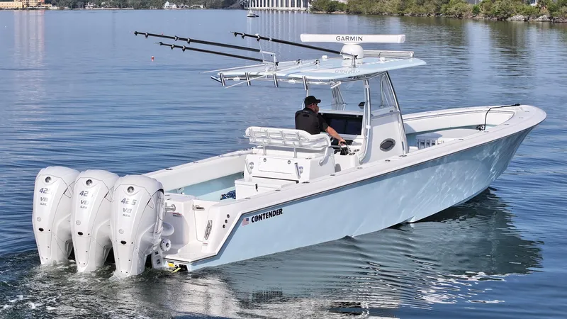  Yacht Photos Pics 2021 Contender 39 ST boat with triple engines cruising on calm water.