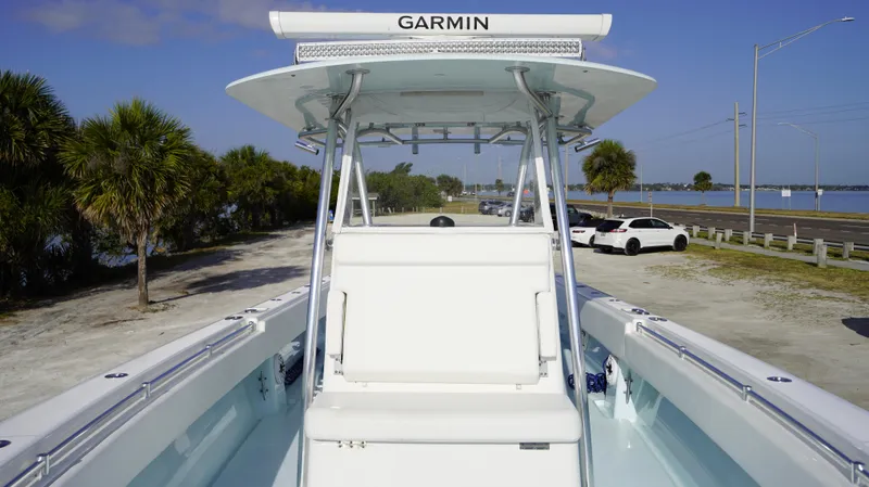  Yacht Photos Pics 2021 Contender 39 ST boat with Garmin equipment, parked near a scenic waterfront.