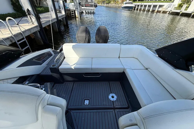  Yacht Photos Pics 2021 Cruisers Yachts 338 CX South Beach Bow Rider interior with white seating and water view.