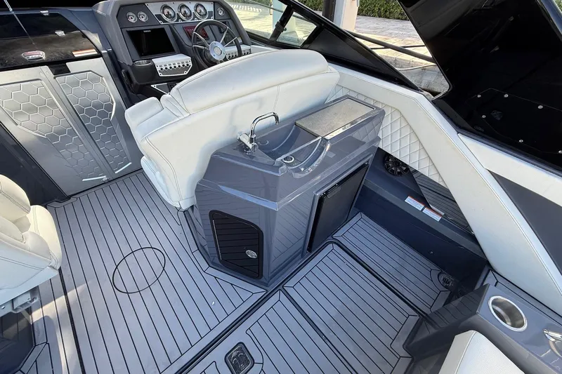  Yacht Photos Pics 2021 Cruisers Yachts 338 CX South Beach Bow Rider interior with sleek helm and seating.