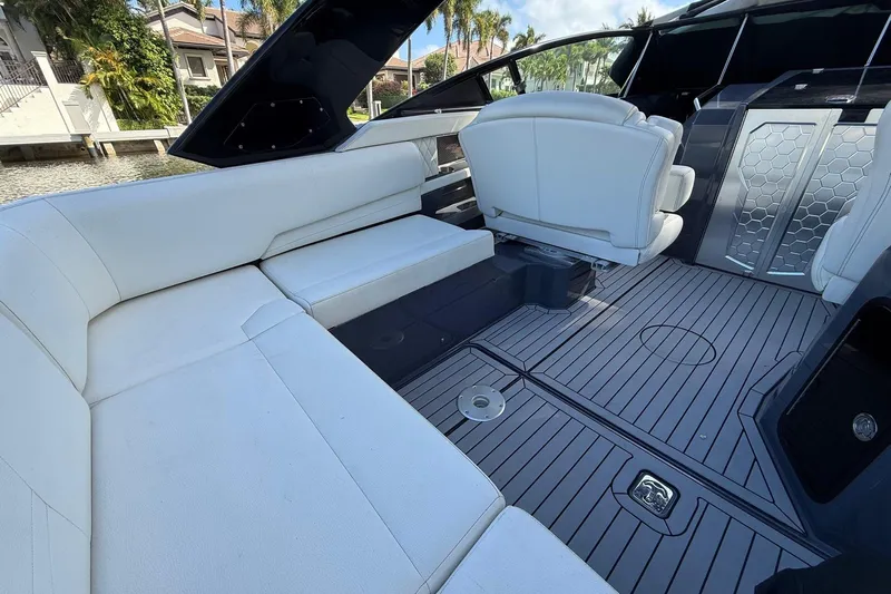  Yacht Photos Pics 2021 Cruisers Yachts 338 CX South Beach Bow Rider interior with white seating and sleek flooring.