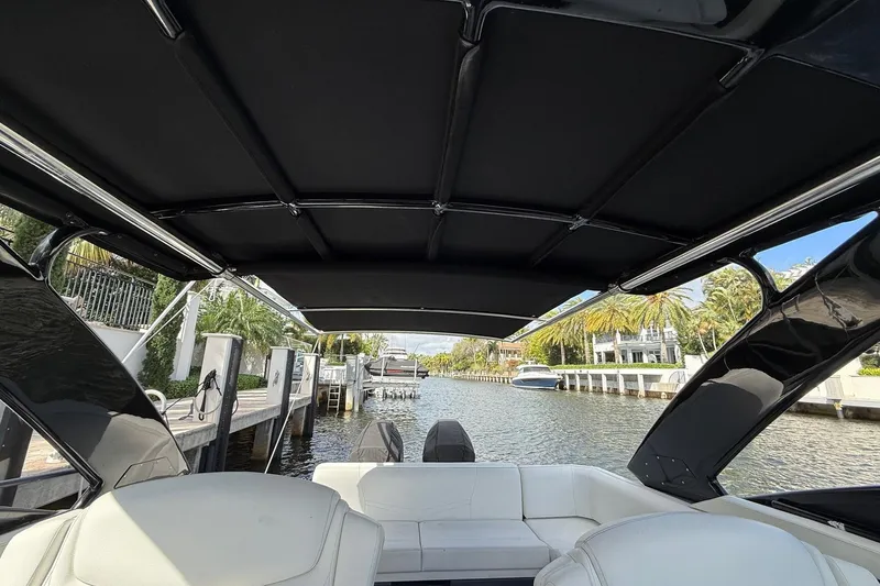  Yacht Photos Pics 2021 Cruisers Yachts 338 CX South Beach Bow Rider interior view, featuring sleek design and waterfront setting.