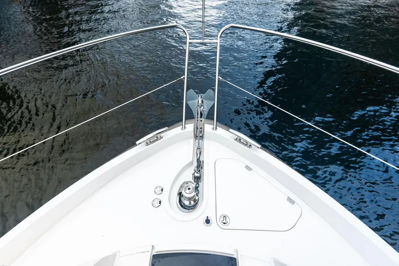 Miller Time Yacht Photos Pics Bow of 2021 Sunseeker Manhattan 52 yacht on calm water.