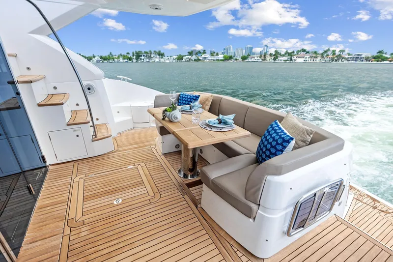 Miller Time Yacht Photos Pics Luxurious Sunseeker Manhattan 52 yacht deck with elegant seating, 2021 model.