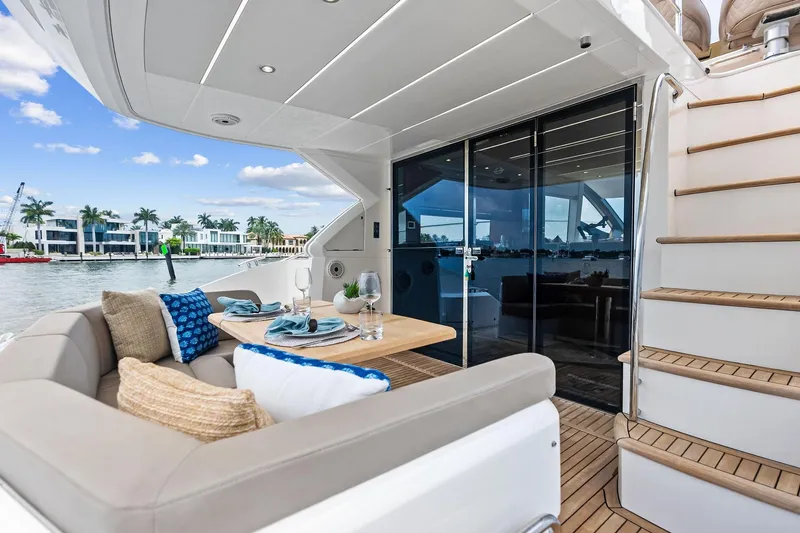 Miller Time Yacht Photos Pics Luxurious 2021 Sunseeker Manhattan 52 yacht with elegant outdoor dining area.