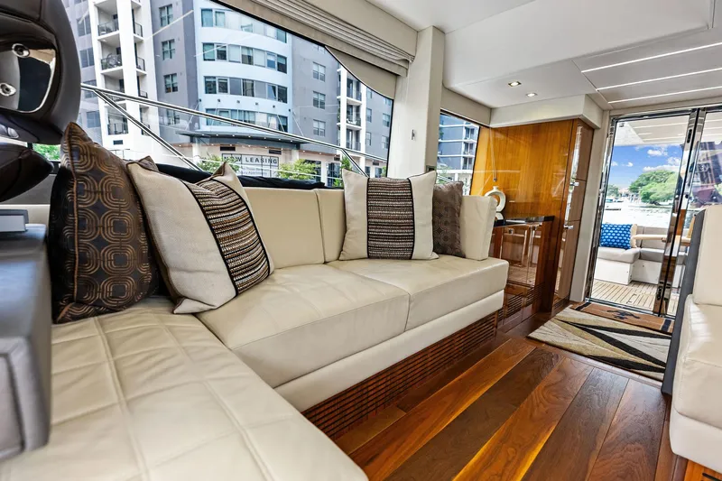 Miller Time Yacht Photos Pics Luxurious interior of 2021 Sunseeker Manhattan 52 yacht with elegant seating and modern decor.