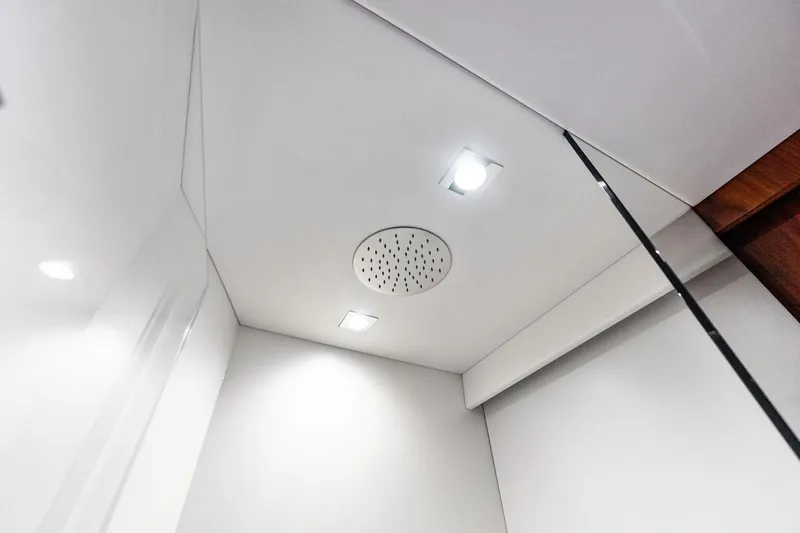 Miller Time Yacht Photos Pics Ceiling view of 2021 Sunseeker Manhattan 52 yacht with modern lighting and speaker.