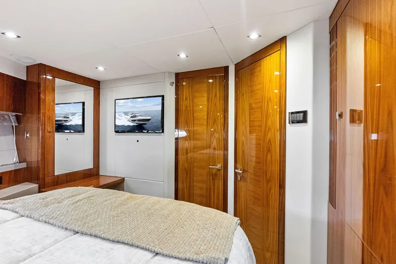 Miller Time Yacht Photos Pics Luxurious cabin interior of 2021 Sunseeker Manhattan 52 yacht with wood finishes and modern amenities.