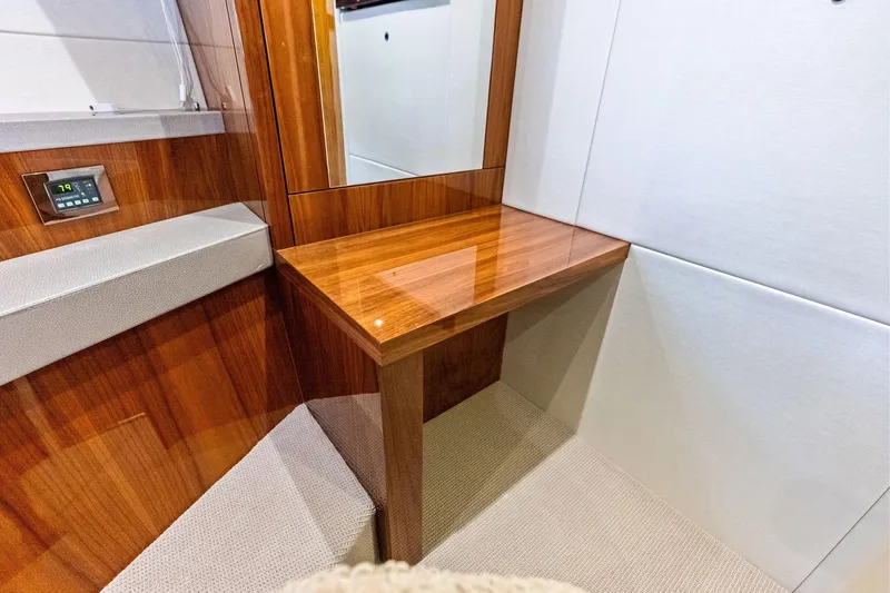 Miller Time Yacht Photos Pics Luxurious interior of 2021 Sunseeker Manhattan 52 yacht with wooden finish and modern design.