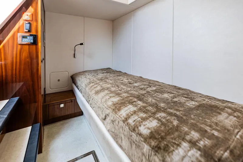 Miller Time Yacht Photos Pics Luxurious cabin interior of 2021 Sunseeker Manhattan 52 yacht with cozy single bed.