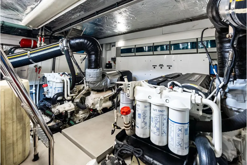 Miller Time Yacht Photos Pics Engine room of 2021 Sunseeker Manhattan 52 yacht, showcasing advanced machinery and components.