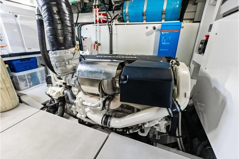 Miller Time Yacht Photos Pics Engine room of 2021 Sunseeker Manhattan 52 yacht, showcasing advanced machinery and components.