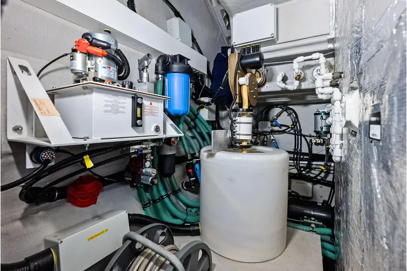 Miller Time Yacht Photos Pics Engine room of 2021 Sunseeker Manhattan 52 yacht with complex machinery and piping.