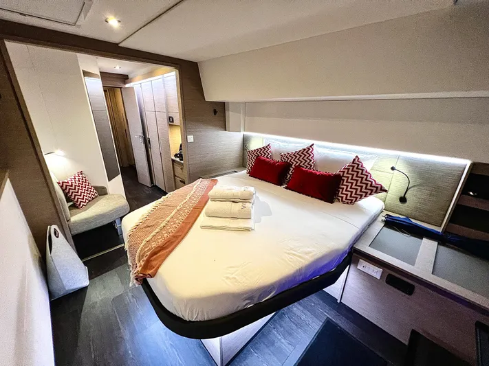 Vienna Yacht Photos Pics Luxurious bedroom interior of 2022 Fountaine Pajot Catamaran Aura 51 with modern decor.