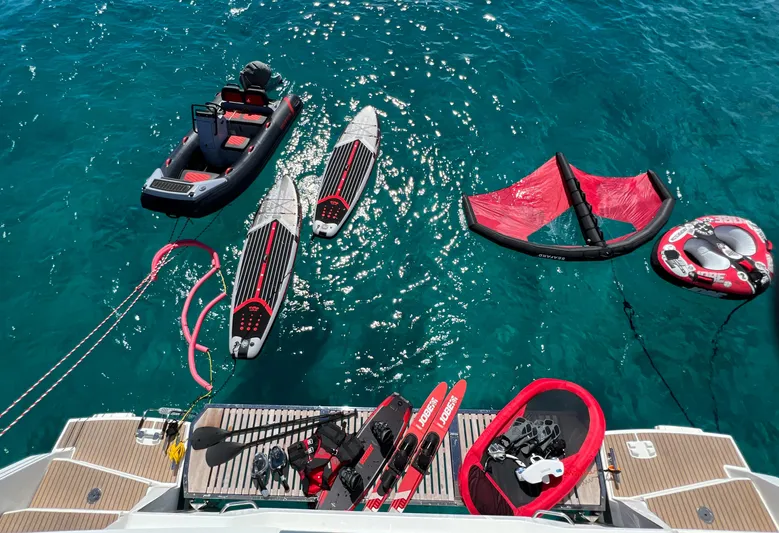 Vienna Yacht Photos Pics Fountaine Pajot Catamaran Aura 51 with water sports gear on turquoise sea, 2022 model.