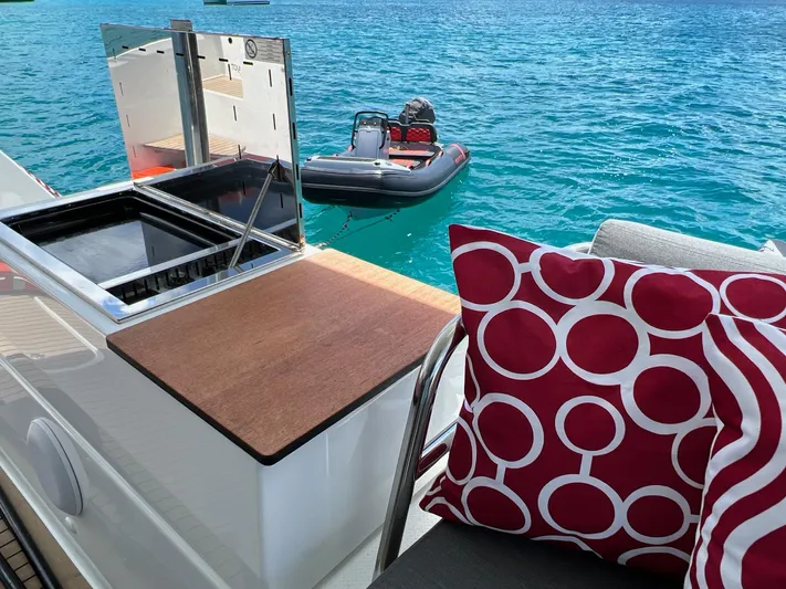 Vienna Yacht Photos Pics Fountaine Pajot Catamaran Aura 51, 2022, with a modern deck and vibrant cushion.