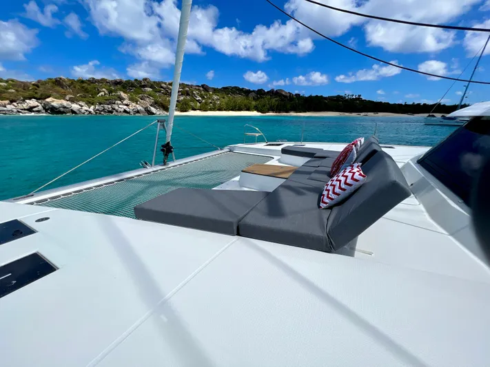 Vienna Yacht Photos Pics 2022 Fountaine Pajot Catamaran Aura 51 with sun loungers on turquoise water.