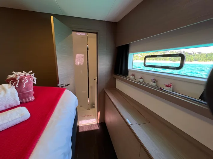 Vienna Yacht Photos Pics Luxurious interior of 2022 Fountaine Pajot Catamaran Aura 51 cabin with ocean view.
