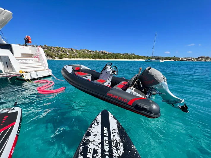 Vienna Yacht Photos Pics Fountaine Pajot Catamaran Aura 51, 2022, with inflatable boat in turquoise waters.