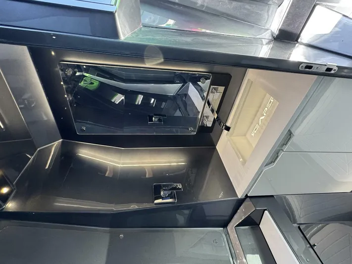 Crypto Excepted! Yacht Photos Pics Interior of 2023 Adrenaline 47 boat, featuring sleek black and gray design elements.