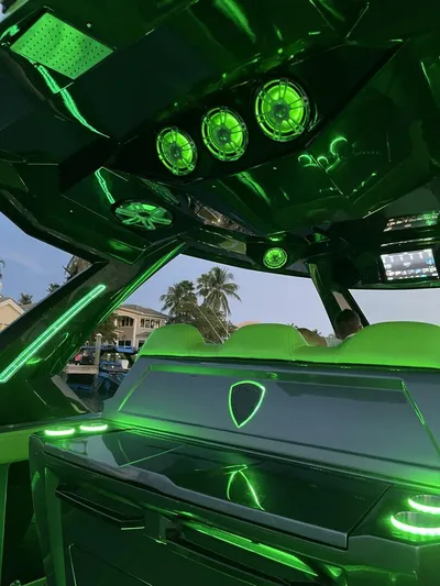 Crypto Excepted! Yacht Photos Pics Futuristic 2023 Adrenaline 47 boat interior with vibrant green LED lighting.
