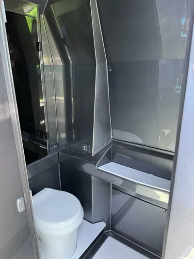 Crypto Excepted! Yacht Photos Pics Modern bathroom interior in 2023 Adrenaline 47 model, featuring sleek design and compact layout.