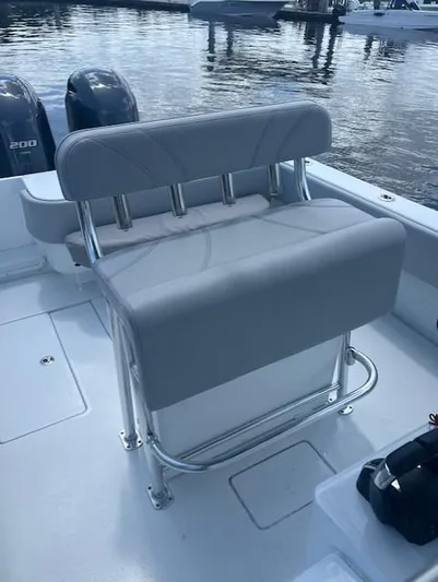  Yacht Photos Pics 2023 Contender 25 Tournament boat with dual engines and cushioned seating at the dock.