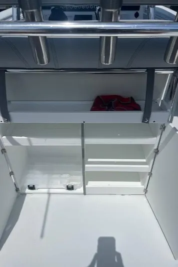  Yacht Photos Pics 2023 Contender 25 Tournament boat interior with storage compartments and rod holders.