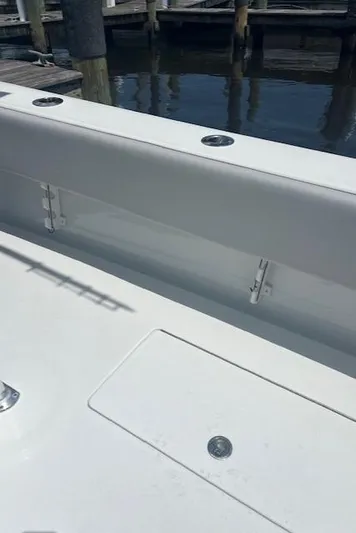  Yacht Photos Pics 2023 Contender 25 Tournament boat interior, featuring sleek white design and rod holders.