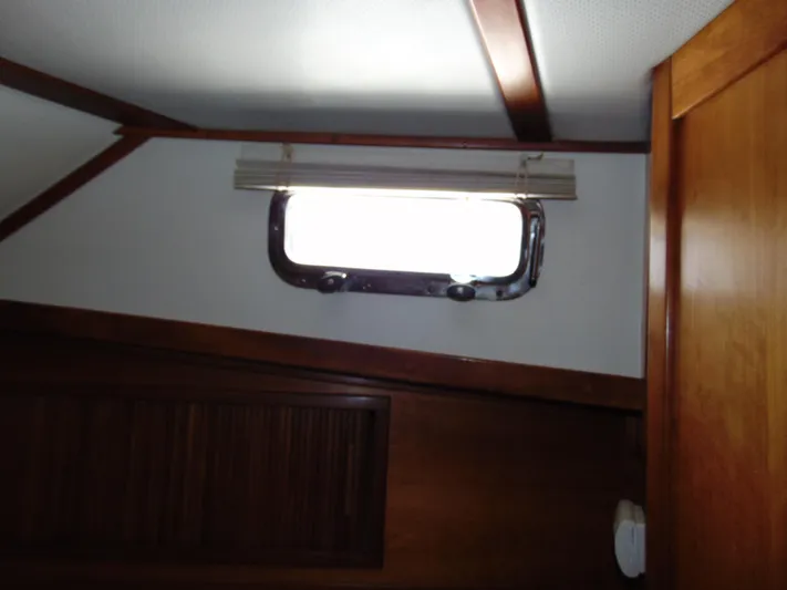 Lady Susan Yacht Photos Pics Interior cabin window of 2004 Sabre 36 Flybridge boat with wooden trim.