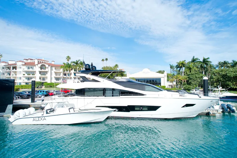 Alexa Yacht Photos Pics 2018 Sunseeker 86 Yacht docked in a marina with a smaller boat named Alexa.