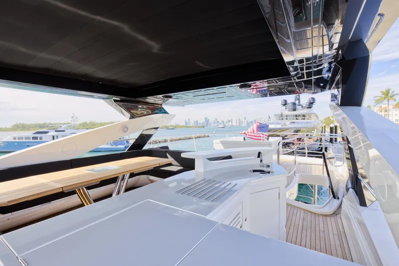 Alexa Yacht Photos Pics 2018 Sunseeker 86 Yacht deck with city skyline view.
