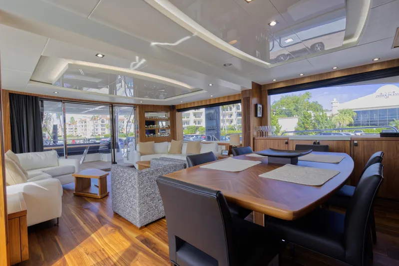 Alexa Yacht Photos Pics Luxurious interior of 2018 Sunseeker 86 Yacht with modern furnishings and large windows.