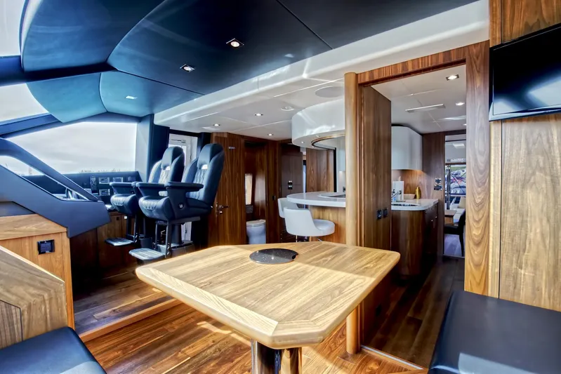 Alexa Yacht Photos Pics Luxurious interior of 2018 Sunseeker 86 Yacht with modern wood finishes and sleek design.