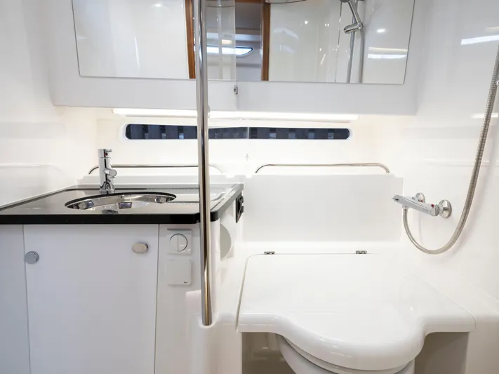  Yacht Photos Pics Modern bathroom in 2024 Nimbus C-11 boat with sleek fixtures and compact design.
