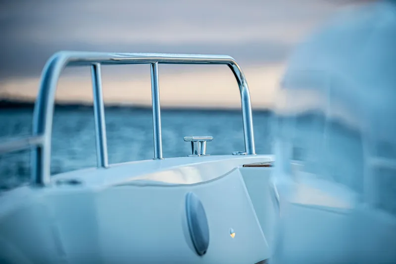  Yacht Photos Pics 2024 Nimbus C-11 boat on water at sunset.