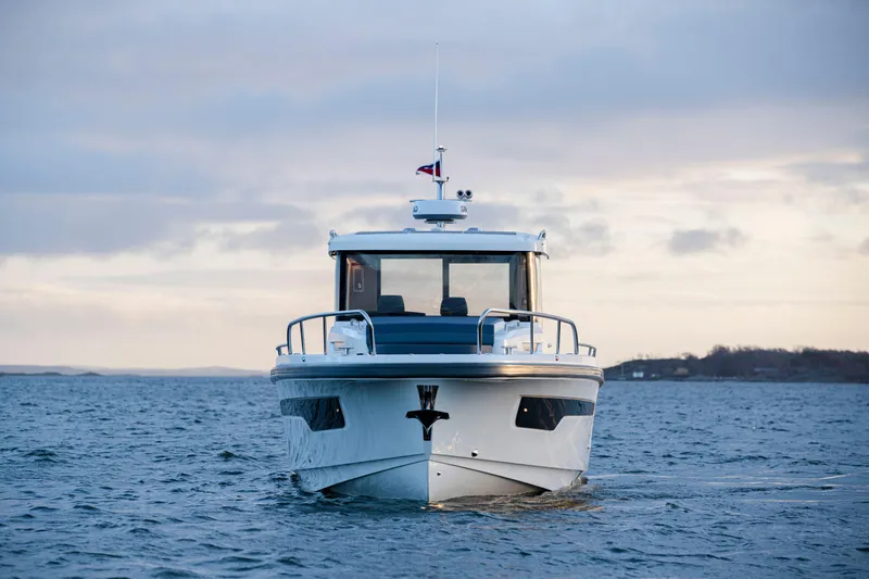  Yacht Photos Pics 2024 Nimbus C-11 boat on open water, front view.
