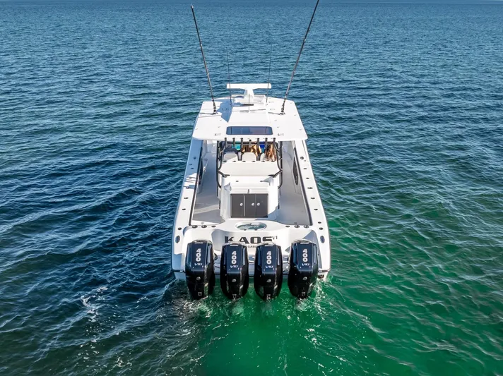  Yacht Photos Pics 2024 Yellowfin 42 boat with four engines on open water.